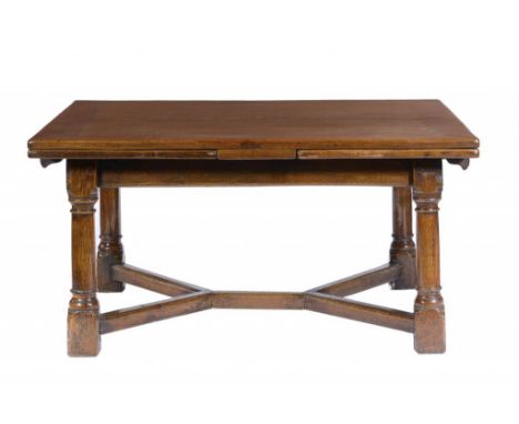 AN OAK DRAW LEAF DINING TABLE, C1930 with quarter sawn boards to the top, 76cm h; 120 x 275cm ++In good condition with fading