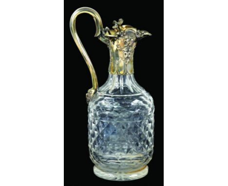 A VICTORIAN SILVER GILT MOUNTED CUT GLASS CLARET JUG with flower finial,  29cm h, by Charles Reilly and George Storer, London