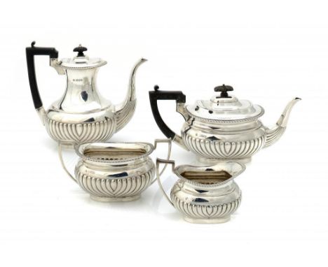 A GEORGE V SILVER TEA AND COFFEE SERVICE coffee pot 22cm h, by Horace Woodward & Co Ltd, London 1911 and 12, 57ozs 10dwts gro