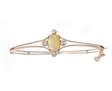 A DIAMOND AND OPAL BRACELET, C1910  in gold ++Unmarked, in fine condition with hardly any sign of wear, the four diamonds cle