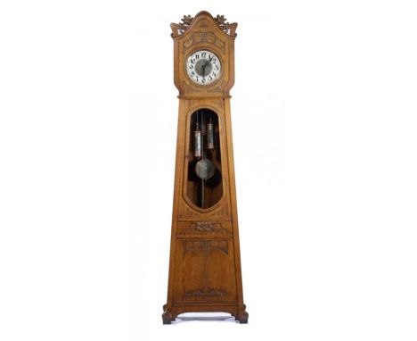 A GERMAN JUGENDSTIL OAK LONGCASE CLOCK, C1910 with stamped and silvered brass dial and gong striking movement, in carved case