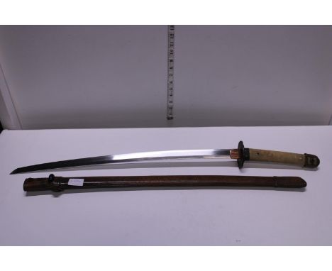 A vintage Samurai sword in leather scabbard. Length of the nagasa is 25.5 inches. shipping unavailable 