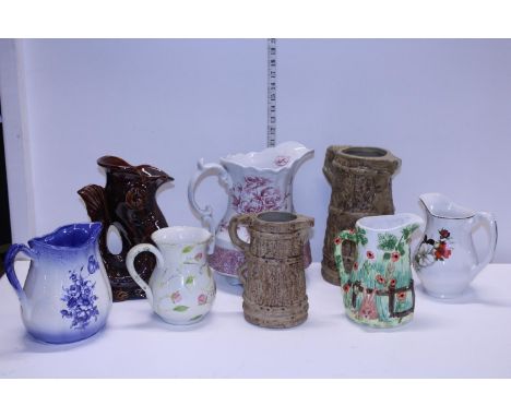 A quantity of assorted ceramic jugs, shipping unavailable 