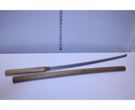 A wooden handled samurai sword in wooden scabbard. Length of the nagasa is 25.25 inches. shipping unavailable 