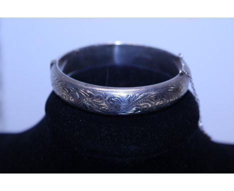 A hallmarked silver bangle with dedication. 18.50 grams &amp; 6cm internal diameter 