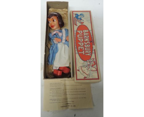 A Barnsbury Puppet of Alice in Wonderland, having moulded rubber head and hard plastic hands, in original box and with instru