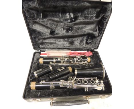 A Bundy clarinet in fitted case with spare reeds and other accessories