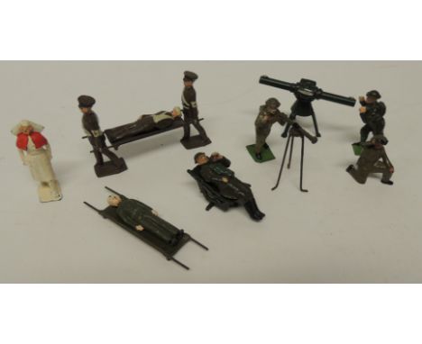 A group of Britains and other painted hollowcast Observer Corps figures, telescope on tripod, large telescope also stretcher 