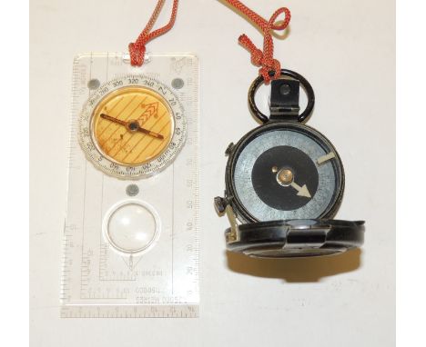 A WWI marching compass in black lacquered brass case and dated 1917 to the back together with a more modern Swedish made comp