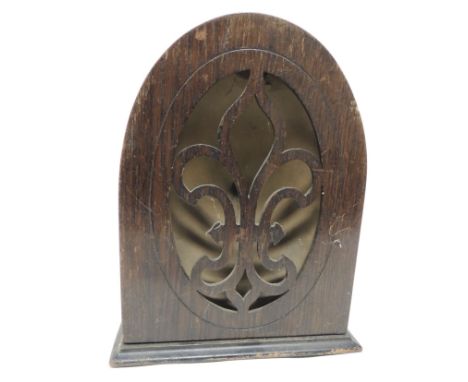 A c.1930's wood cased speaker, the arched case with fleur de lis panel to the front, 33.5cms high