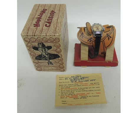 Hopalong Cassidy - a Timex wristwatch in original box and on original Western saddle stand, with original Guarantee slip
