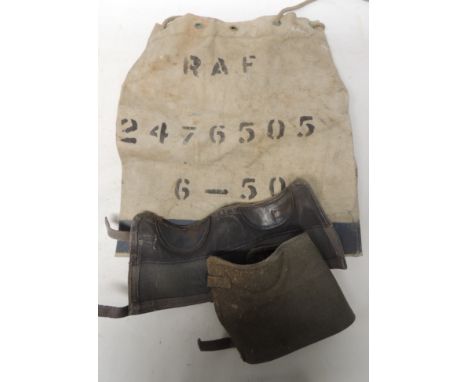 A RAF canvas kit bag with black stencilled RAF and numbers together with a pair of light blue canvas and leather gaiters