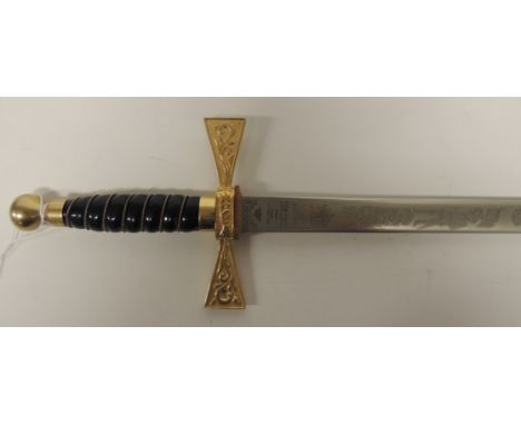 A 20th Century sword having wire bound black grip, gilt metal guard and Wilkinson blade etched to one side with scrolling fol