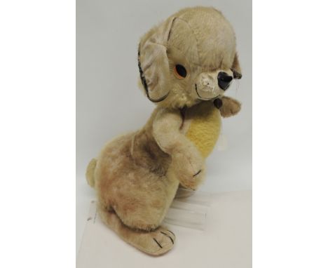 A large Merrythought toy rabbit with plush covering in pink/yellow and cream, composition eyes and soft black plastic nose, s