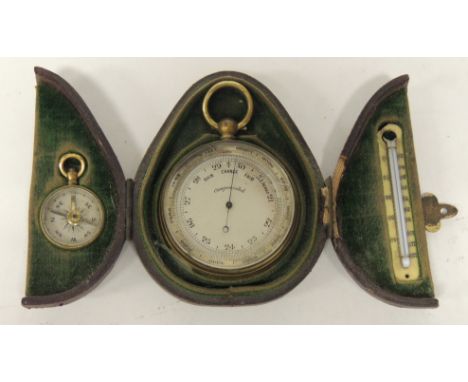 A Victorian cased pocket barometer, compass and thermometer; the barometer in gilt metal case and with silvered metal dial, 5