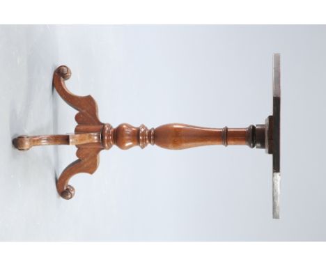A VICTORIAN MAHOGANY TRIPOD TABLE, the octagonal top raised on a baluster stem continuing to hipped downswept legs terminatin