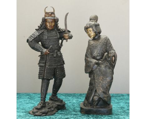 A JAPANESE BRONZE FIGURE OF A SAMURAI, modelled wearing armour with a horned helmet, and brandishing a sword, to a naturalist