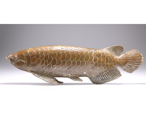 A LARGE BRONZE MODEL OF A CARP, supported by outstretched fins.&nbsp;Measures 12.5cm high, 44.5cm long