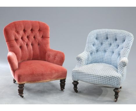 TWO VICTORIAN DEEP BUTTON UPHOLSTERD COUNTRY HOUSE ARMCHAIRS, each with turned legs and moving on castors.&nbsp;