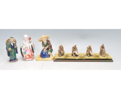 A collection of 20th century antique Chinese oriental ceramic porcelain and terracotta / clay figurines of old people in vari