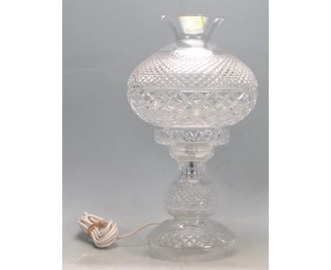 A vintage 20th century Waterford crystal table lamp having a bulbous faceted shade raised on a tapering circular base. Measur