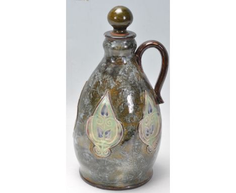 A believed 19th century Royal Doulton jug / flask of a baluster form with turned finial, S-shaped handle and tear drop panel 