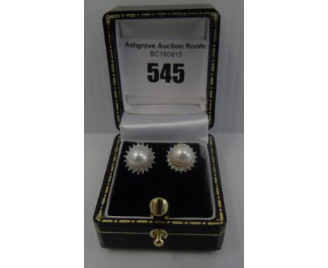 A Pair of White Gold Diamond and Pearl Earrings.