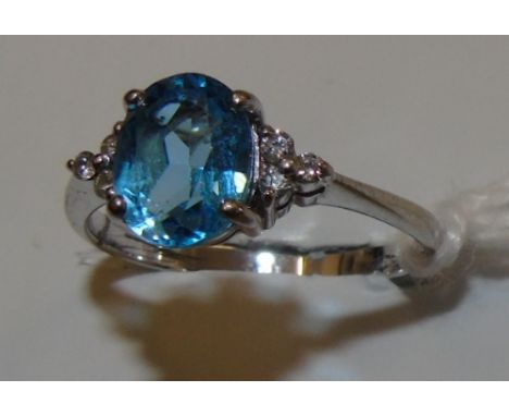 A White Gold Diamond and Topaz Ring.