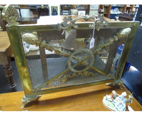An Early 20th Century Pierced Brass Fender, with flaming torch design.