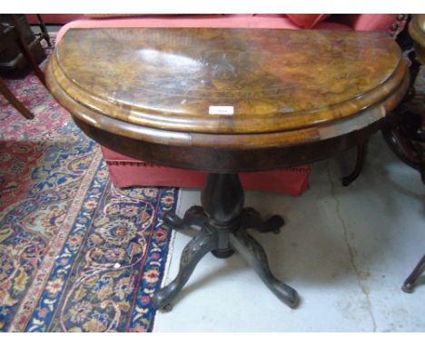 A Victorian Figured Walnut Demi Lune Card Table, fold over top