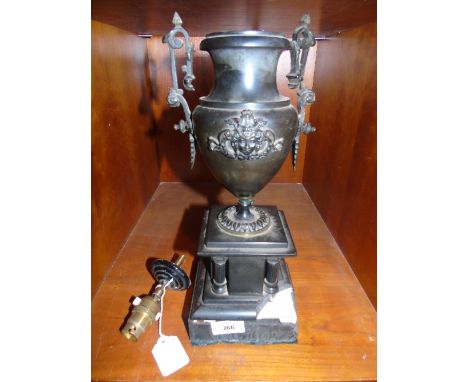 A 19th Century Slate and Ormolu Mounted Urn on a Slate Base.