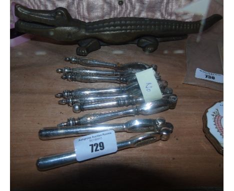 Four Various Antique Nut Crackers, a Nut Pick and a Crocodile Brazil Nut Cracker. 