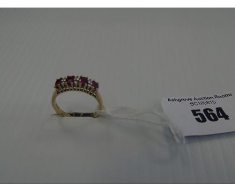 A Gold Diamond and Ruby Ring.