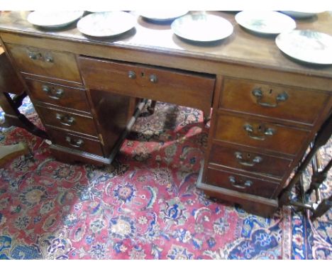 A Georgian Mahogany Partner's Desk of Neat Proportions, to each side a central drawer with four side drawers, an extension sl