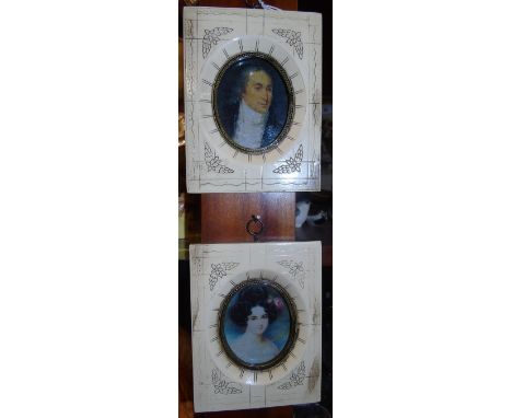 A Pair of Oval Bust Portrait Miniatures of a lady and a gentleman.