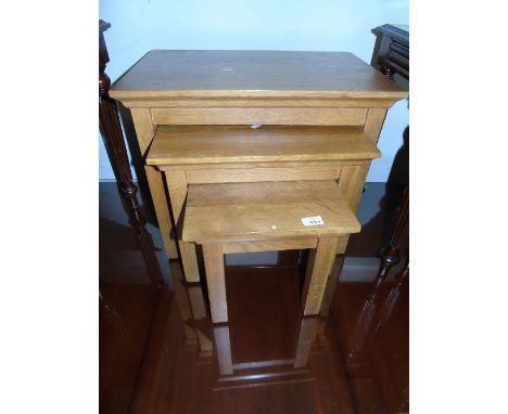 A Pine Kitchen Table with Drawer (5ft 2ins x 2ft 10ins) & Two Kitchen Chairs, together with a light coloured Nest of Three Ta