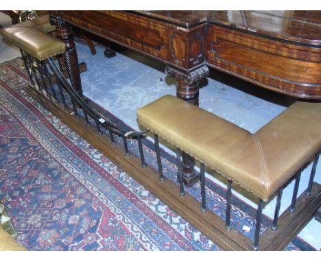 A Traditional Club Fender with pale green leather upholstered corner seats raised on vertical steel rails and stepped moulded