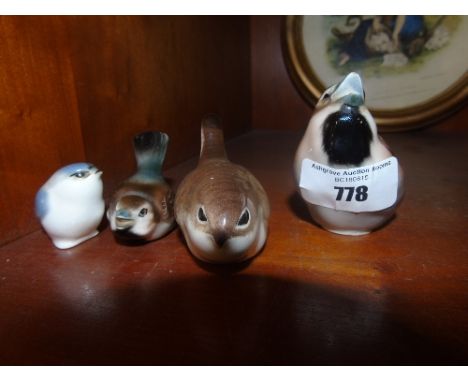 A Collection of Four Goebel/Hummel Bird Figures.