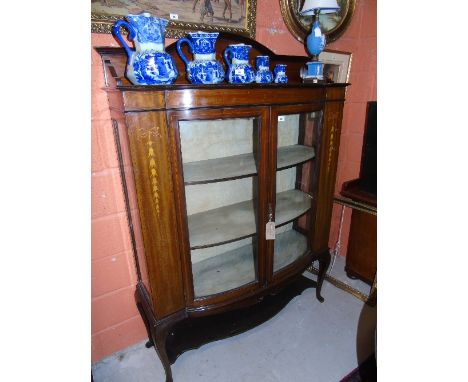 An Edwardian Mahogany Glazed Floorstanding Display Cabinet, the central arched and moulded pediment over a pair of three quar