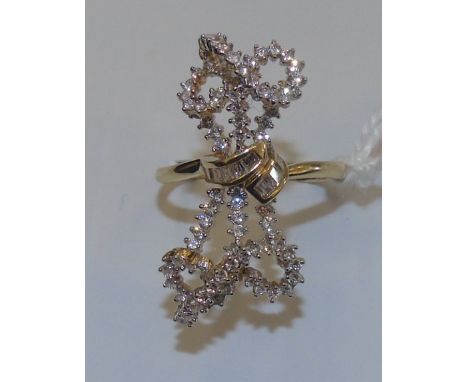 An Eighteen Carat Diamond Cluster 'Ribbon' Ring.