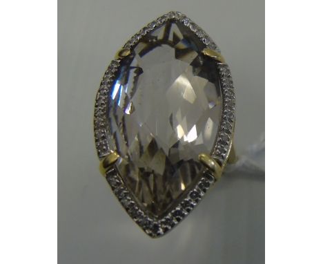 An Eighteen Carat Diamond and Topaz Cluster Ring.