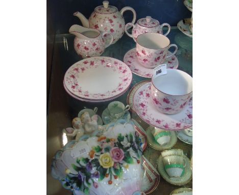 A Bavarian Tea Set for Two, decorated in trailing pink flowers and comprising of a teapot, milk jug, sugar bowl and two cups,