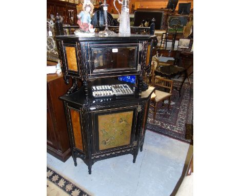 A Wonderful Early 20th Century Ebonised Corner Cabinet, with gold detail and painted panel depicting birds with a mirrored to