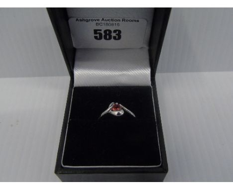 A Silver Gem Set Ring.