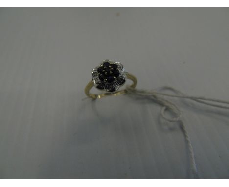 A 9ct Gold Sapphire & Diamond Floral Cluster Ring.