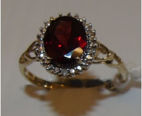 A Nine Carat Diamond and Garnet Cluster Ring