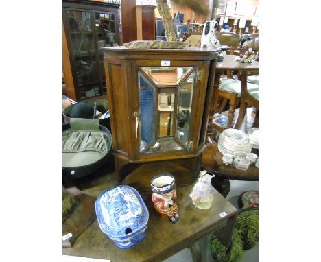 A Late 19th/early 20th Century Walnut Wall Hanging Corner Display Cabinet, with one bevelled panel mirror glass door with she