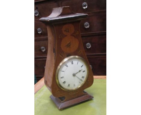 An Art Nouveau mahogany and inlaid mantle clock  