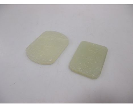 Two Chinese jade rectangular pendants carved with a ship and a boating figure respectively  