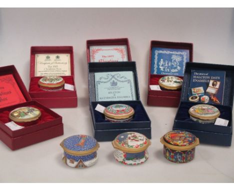 Fifteen Halcyon Days enamel Christmas boxes, including ten in original boxes with certificates, dating from the 1970's, 80's 